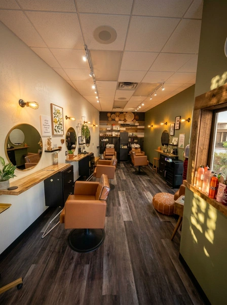 Warm green and wood interior of Good Vibes Salon