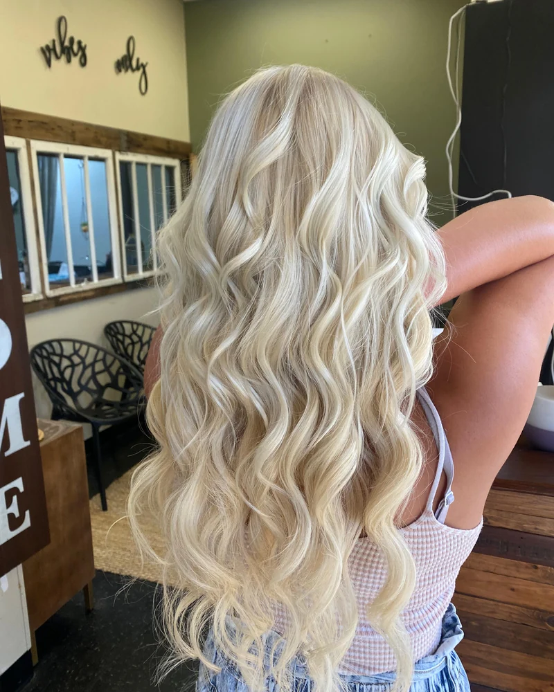 Long, very light blonde waves with a creamy finish.