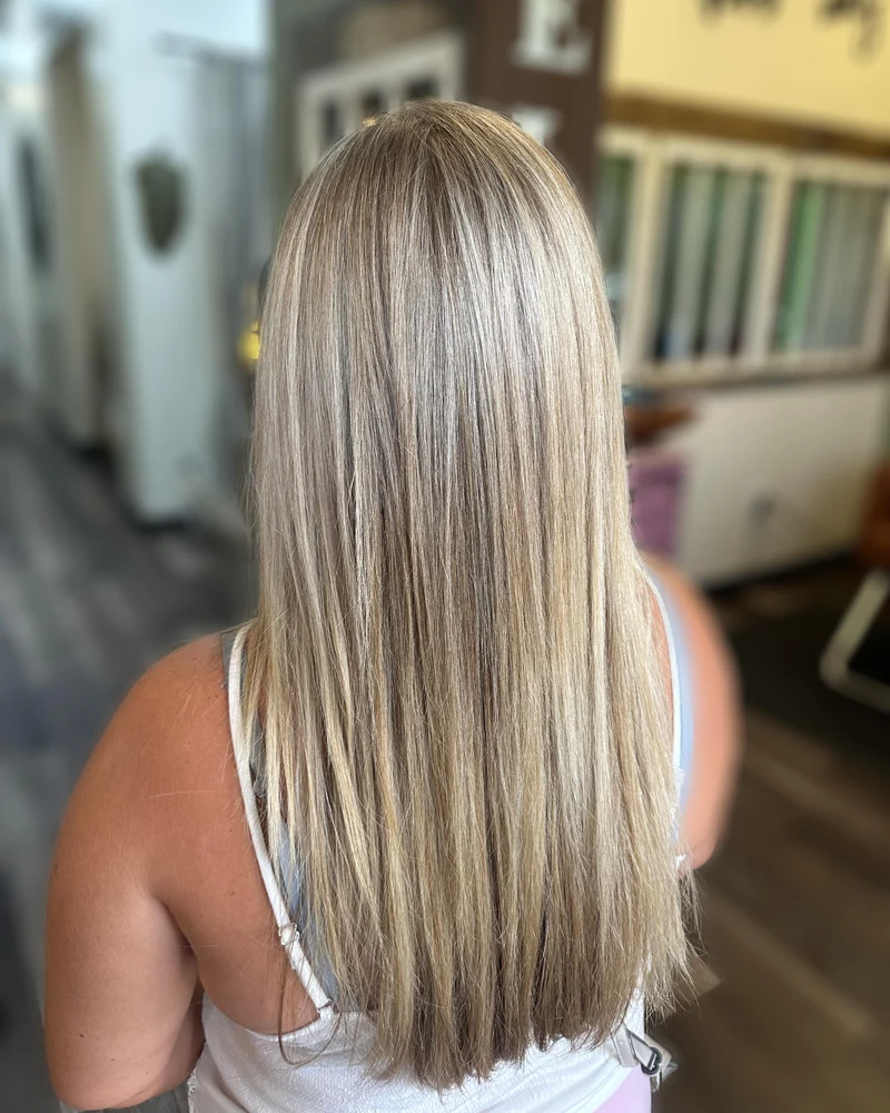 Long straight ash-blonde hair with dimensional strands.