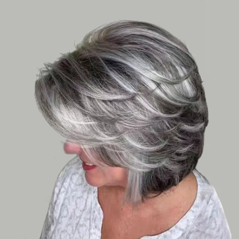 Layered silver and charcoal hairstyle with soft movement.