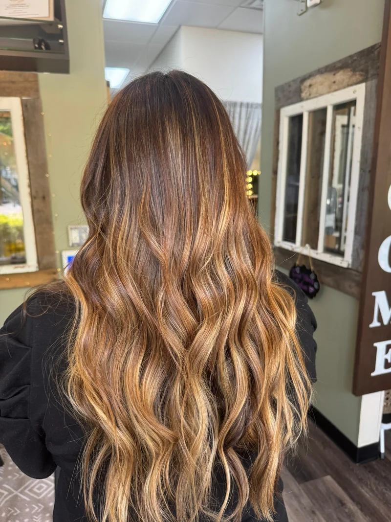 Brunette depth and caramel ribbons through long waves.