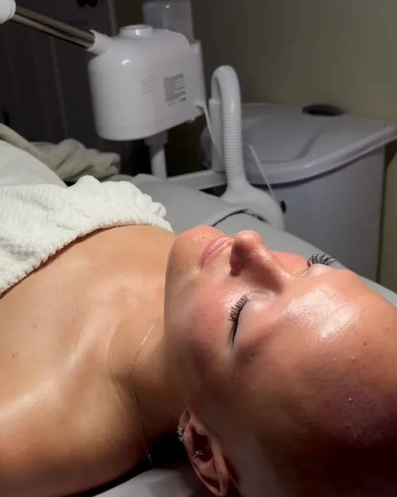 A client resting comfortably after a facial treatment at Good Vibes