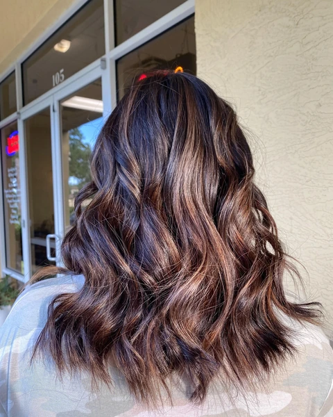 Rich dark brunette bob with glossy dimensional movement