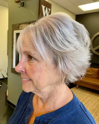 Sculpted short haircut with clean shape and a polished finish