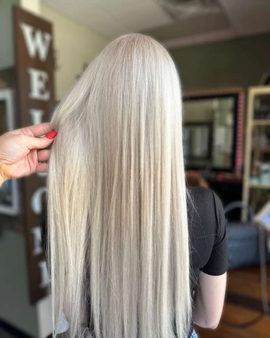 Long platinum hair with a smooth straight reflective finish