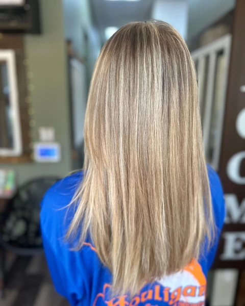 Straight blonde salon finish with smooth surface and visible ends