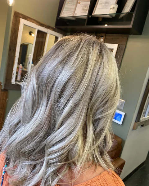 Cool blonde corrective color result with balanced tone and visible dimension