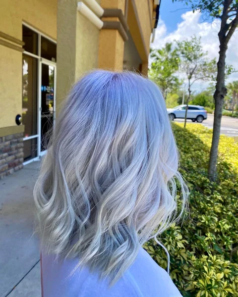 Precision silver bob haircut with visible structure and polished curved ends