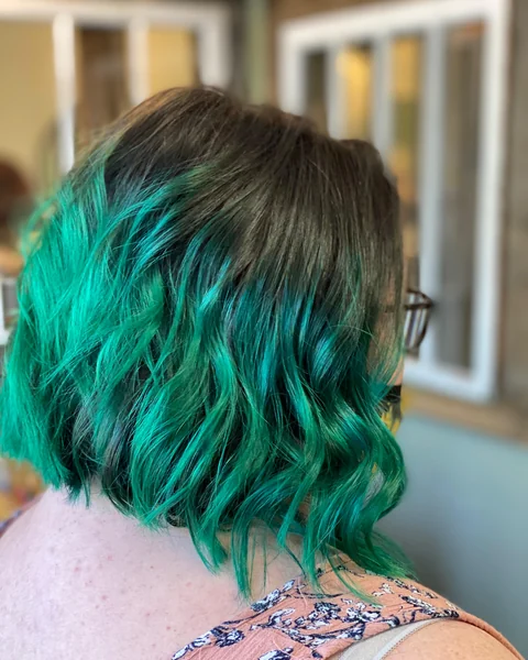Creative teal bob haircut with a polished salon finish and clear shape