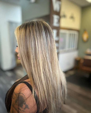 Long blonde salon result with sleek shine from crown through ends
