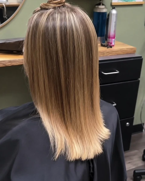 Polished dimensional hair finish photographed from the back