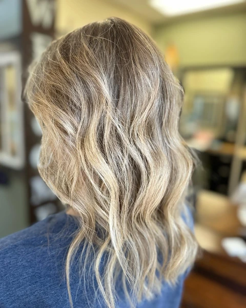 Polished blonde lob with visible shape and movement