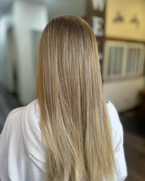 Glassy straight blonde smoothing result photographed from the back