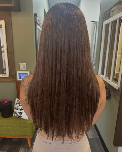 Long brunette hair with a sleek glossy finish