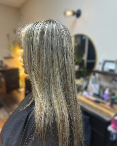 Sleek dimensional blonde finish photographed from partial profile