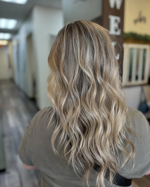 Soft dimensional blonde waves photographed from the back