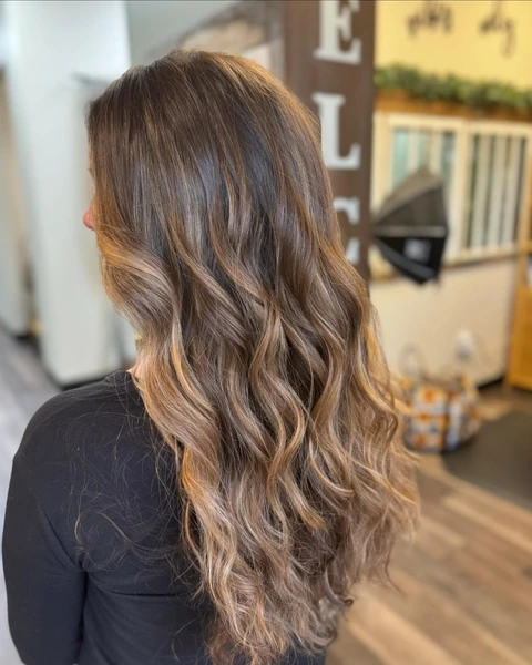 Warm brunette waves photographed from partial profile