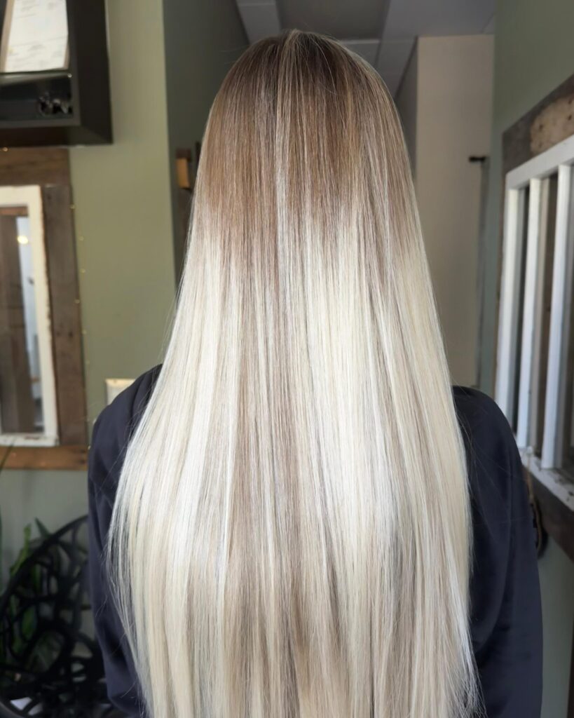 Long sleek neutral-toned hair photographed at Good Vibes Salon